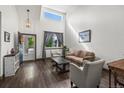 Bright living room boasts hardwood floors, high ceilings, and large windows at 11861 Fairplay St, Commerce City, CO 80603