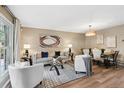 Inviting living room with stylish furnishings, neutral tones, and wood flooring at 9306 Garrison Dr, Broomfield, CO 80021