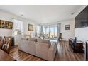 Comfortable living room area with sliding glass doors that allow for ample sunlight at 27957 E 9Th Dr, Aurora, CO 80018