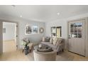 Light-filled living room with a gray sofa and coffee table at 3756 Decatur St, Denver, CO 80211