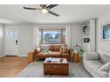 Cozy living room with large windows and stylish furniture at 12017 W 58Th Pl, Arvada, CO 80004