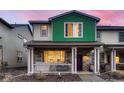 Charming two-story home with a welcoming front porch and colorful exterior at 21538 E 59Th Pl, Aurora, CO 80019