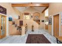 Elegant foyer with marble floors, high ceilings, and beautiful archways leading to other living spaces at 1426 Rembrandt Rd, Boulder, CO 80302