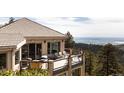 Enjoy outdoor living on the spacious deck with stunning views, perfect for entertaining and relaxing at 1426 Rembrandt Rd, Boulder, CO 80302