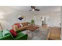 Well-lit living room featuring hardwood floors, a comfortable sofa, and stylish decor at 860 Magnolia St, Denver, CO 80220