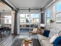 Bright living room with modern decor, large windows, and a view of the outdoor patio at 11659 W 44Th Ave, Wheat Ridge, CO 80033