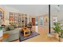Cozy living room with built-in shelving, comfortable seating, and hardwood floors at 831 Crescent Dr, Boulder, CO 80303