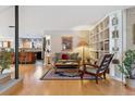 Inviting living room featuring an open layout, hardwood floors, and custom bookshelves at 831 Crescent Dr, Boulder, CO 80303