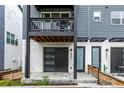 Stylish modern entrance featuring a sleek garage door and inviting front door at 2052 Alcott Way, Broomfield, CO 80023