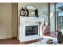A cozy fireplace with a decorative mantel and mirror, enhancing the room's character at 5455 Landmark Pl # 1403, Greenwood Village, CO 80111
