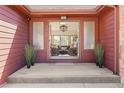Inviting entryway featuring a large open doorway with a view into a living room area at 7570 Windford, Parker, CO 80134