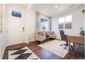 Bright office with a door with glass and a comfy sitting area at 4202 Sandstone Dr, Mead, CO 80504