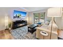 Cozy living room featuring an electric fireplace, large TV, and comfortable seating for relaxing evenings at 764 Blue Ridge Rd, Breckenridge, CO 80424