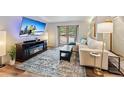 Living room showcasing a TV, fireplace, couch and bright natural light at 764 Blue Ridge Rd, Breckenridge, CO 80424