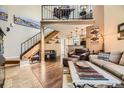 Inviting living room featuring a loft area, wood floors, and natural light at 814 S Vance St # F, Lakewood, CO 80226