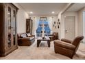 Inviting living room with neutral walls, plush seating, and ample natural light for comfortable gatherings at 9521 Garnett Way, Arvada, CO 80007