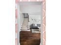 View of the staircase from entryway, showcasing hardwood floors at 350 Cherry St, Denver, CO 80220