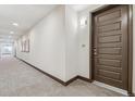 Hallway with door and unit number at 485 Interlocken Blvd # 202, Broomfield, CO 80021