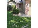 Inviting entryway featuring a well-manicured lawn at 5201 E 127Th Dr, Thornton, CO 80241