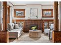 Spacious living room featuring a fireplace and built-in shelving at 1149 Steele St, Denver, CO 80206