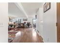 Open-concept living room features hardwood floors and plenty of natural light at 46 S Nome St, Aurora, CO 80012