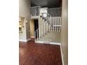 Stairway with white railing and carpeted steps that lead to a second floor at 14096 E Radcliff Cir, Aurora, CO 80015