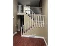 View of a home stairway with railing and access to the second level at 14096 E Radcliff Cir, Aurora, CO 80015