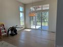 Bright dining room with hardwood floors and access to the outdoor deck at 5841 Powell Rd, Parker, CO 80134