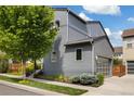 Charming two-story home featuring modern architecture, an attached garage, and lush landscaping at 6760 Mariposa Ct, Denver, CO 80221