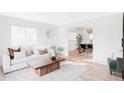 Bright and airy living room featuring contemporary décor and natural light at 6211 W Fremont Pl, Littleton, CO 80128