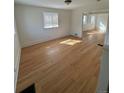 Bright and airy living room with gleaming hardwood floors and ample natural light, creating a welcoming space at 253 7Th St, Frederick, CO 80530