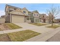 A row of beautiful homes with well-kept lawns line a quiet street at 4574 Walden St, Denver, CO 80249