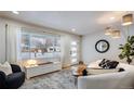 Bright living room with modern furniture and fireplace at 1478 S Krameria St, Denver, CO 80224