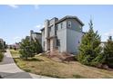 Well-maintained home featuring lush landscaping, mature trees and stone accents in a desirable neighborhood at 3368 Cranston Cir, Highlands Ranch, CO 80126