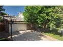 Spacious garage with a basketball hoop on the driveway at 16639 E Berry Ln, Centennial, CO 80015