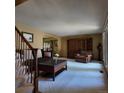 Cozy living room with plush seating, large window, and access to a dining space at 16639 E Berry Ln, Centennial, CO 80015