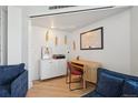 A modern office area featuring white cabinets and blonde wood desk at 550 E 12Th Ave # 810, Denver, CO 80203