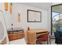 A modern office area featuring white cabinets and blonde wood desk at 550 E 12Th Ave # 810, Denver, CO 80203