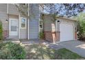 Charming home with a one car garage, brick accents and a well-kept front lawn at 562 W Crestline Cir # 7D, Littleton, CO 80120