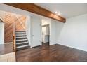 Inviting living room with hardwood floors, a staircase, and laundry area at 1233 S Yosemite Way # 74, Denver, CO 80247