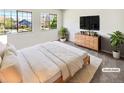 Well-lit bedroom showcasing two large windows and a stylish dresser at 16750 E Ada Pl, Aurora, CO 80017
