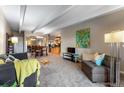 Spacious living room with open floor plan and view into dining area and kitchen at 130 N Pearl St # 805, Denver, CO 80203