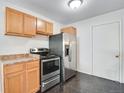 Efficient kitchen with stainless steel appliances and light wood cabinets at 153 S Pierce St, Lakewood, CO 80226