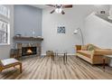 Cozy living room with a stone fireplace, vaulted ceilings, and lots of natural light at 4301 S Pierce St # 6D, Littleton, CO 80123