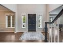 Grand entrance foyer features hardwood floors, high ceilings, and abundant natural light at 10188 Stephen Pl, Highlands Ranch, CO 80130