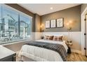 Cozy bedroom with a queen bed and neutral decor at 16559 Peak Way, Broomfield, CO 80023