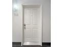 Apartment 302 featuring a white door and modern light fixture at 1062 Rockhurst Dr # 302, Highlands Ranch, CO 80129