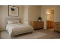 Serene main bedroom featuring neutral tones, soft carpeting, and natural light at 2980 W Centennial Dr # L, Littleton, CO 80123