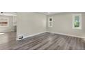 Open floor plan showcases updated flooring, neutral paint, base trim, and modern lighting at 3636 Ames St, Wheat Ridge, CO 80212