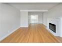 Bright living room with hardwood floors and a fireplace at 10825 Brewer Dr, Northglenn, CO 80234